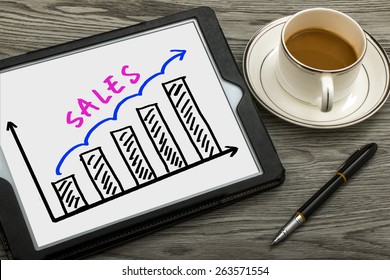 Sales Graph Concept Hand Drawing On Tablet Pc