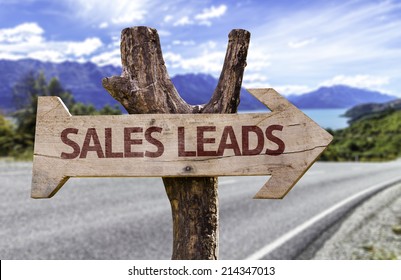 Sales Leads Wooden Sign With A Street Background 