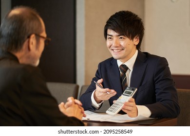 A Sales Man Proposing A Restaurant Refurbishment Plan