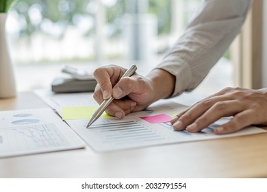 The Sales Manager Is Checking The Monthly Employee Sales Data For Accuracy Before Paying The Commission, He Points To The Document Displayed In The Form Of A Chart. The Concept Of Paying Commissions.