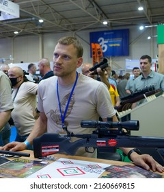 Sales Manager Consulting At Gun Shop, Rifles On The Counter. Arms And Safety 2021. June 15, 2021. Kyiv, Ukraine