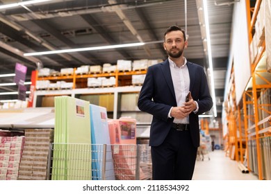 Sales Manager At A Hardware Store In The Flooring Department. Sale Of Parquet, Laminate And Linoleum, Carpet