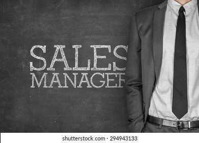 Sales Manager On Blackboard With Businessman On Side