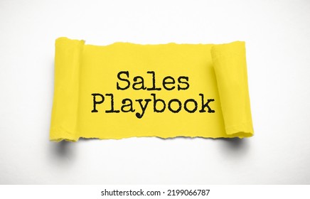 Sales Playbook On Yellow Torn Paper. Business Concept