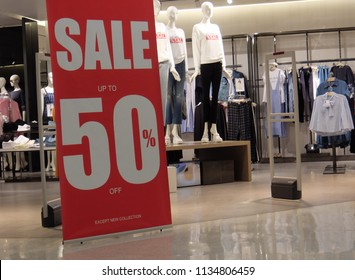 Sales Promotion Of Woman Fashion Clothes Retail Store In Shopping Mall. Store Front Display For Fashion Background.