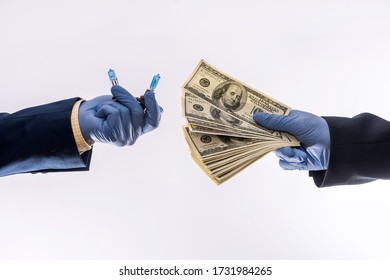 Sales In Quarantine Conditions Coronavirus Hands Holding Car Light Bulbs And Dollar Bills Isolated. Buying Car Concept