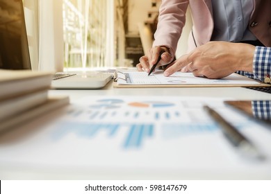 Sales Team Discussion Process.Business Crew Working With New Startup Project.Notebook,tablet Wood Table, Using Devices.Creative Idea Presentation.Analyze Market Stock.Blurred Background,film Effect.