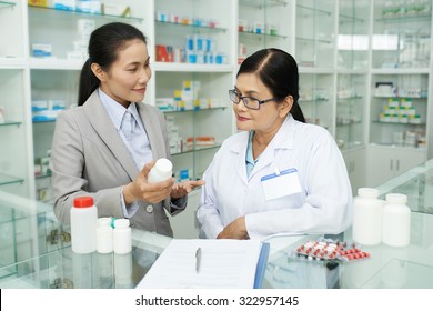 Sales woman offering new products to pharmacist