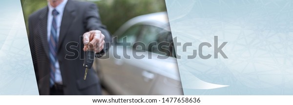 Salesman offering a\
car key; panoramic\
banner