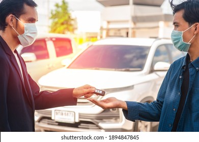 Salesman Wear Mask  Giving Key Car To Customer Concept Business Finance Insurance Coronavirus Covid19 