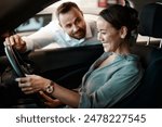 Salesman, woman and purchase a new car at dealership with test drive, happy and insight of vehicle details. Auto deal, customer and employee with professional service for transport safety and hiring