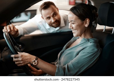 Salesman, woman and purchase a new car at dealership with test drive, happy and insight of vehicle details. Auto deal, customer and employee with professional service for transport safety and hiring - Powered by Shutterstock