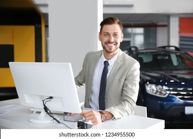 Salesman Working In Modern Car Dealership. Buying New Auto