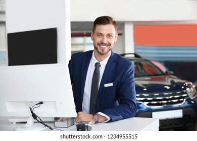 Salesman Working In Modern Car Dealership. Buying New Auto