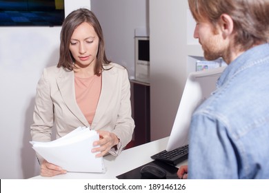 Salesperson Checking A Contract