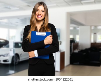 Saleswoman With Folder And Auto Show Background