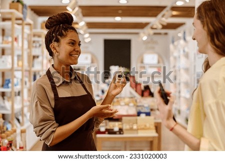 Saleswoman giving consultation to customer in store