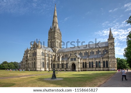 
Salisbury Cathedral on a summer afternoon as seen from the North. In the foreground is the Statue of the “Walking Madonna” by Elizabeth Frink