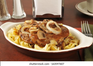 Salisbury Steak With Sauteed Mushrooms And Onions On Noodles