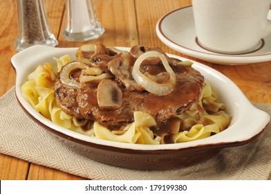 Salisbury Steak With Sauteed Mushrooms And Onions On Noodles