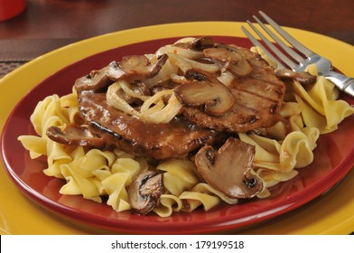 Salisbury Steak With Sauteed Onions And Mushrooms On Noodles