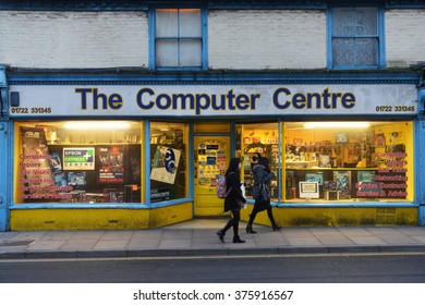 SALISBURY, UK - FEB 11, 2015: People Walk Past A Computer Shop On A City Centre Street.