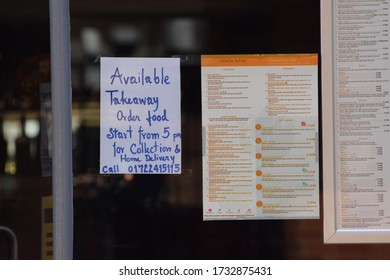 Salisbury, UK. May 16 2020. A Sign On A Sit Down Restaurant Window Advising That Takeaway And Collection Of Food Is Only Now Available Due To The Coronavirus Covid-19 Pandemic. 