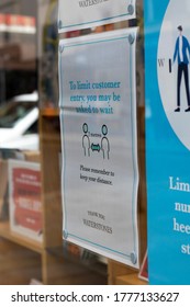 Salisbury, Wiltshire, England - July 6, 2020, Waterstones Book Store With COVID 19 Health And Safety Social Distancing Information Sign For Shoppers In Retail Store Window