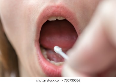 Saliva Sample Is Taken With Cotton Swabs