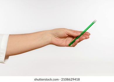 Saliva Suction Tube In Hand On White Background, Close-up