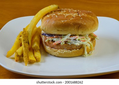 Salmon Burger Top  With Cole Slaw On Seame Bun.