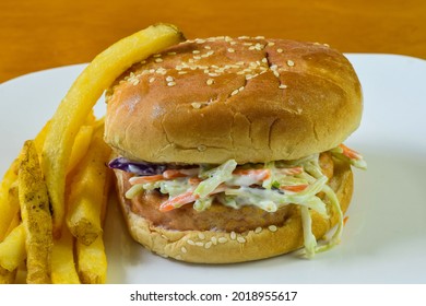 Salmon Burger Top  With Cole Slaw On Seame Bun.