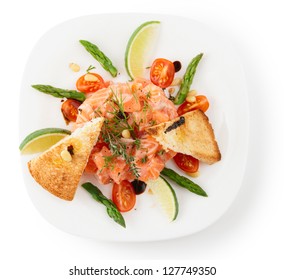 Salmon carpaccio in plate isolated on white background with shadow
