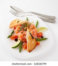 Salmon carpaccio shot on light grey surface
