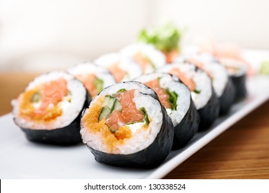 Salmon and caviar rolls served on a plate