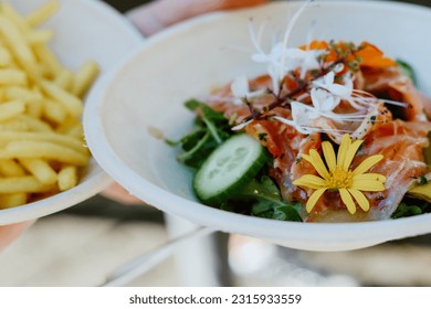 Salmon and chips outdoor eating - Shutterstock ID 2315933559