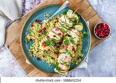 Salmon And Courgette Skewers With Lemon Couscous And Pomegranate Seeds - Overhead View