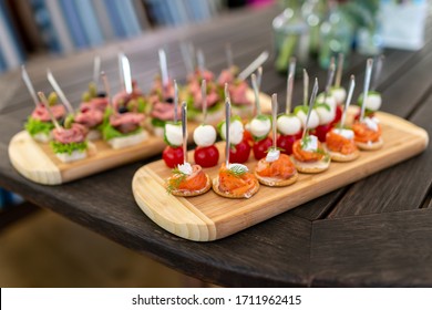 Salmon cream cheese  and tomato mozzarella canape on banquet table 