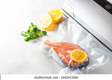 Salmon fillets in a vacuum package. Sous-vide, new technology cuisine. Selective focus, copy space