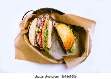 Salmon Fish Burger Cut In Two Parts On White Background. View From Top. Isolated On White