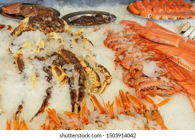 Salmon Fish, Crab Legs And Shrimps, Sea Food On The Ice