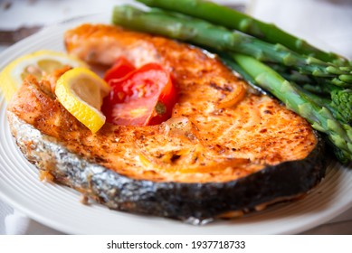 Salmon Fish Steak Cooked With Vegetables And Lemon