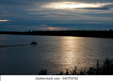 Salmon Fishing Boat Floating On Yukon River In Midnight Sun Alaska