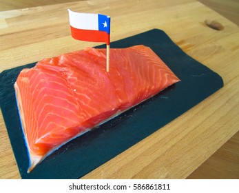 Salmon With Flag Of Chile On Wooden Background