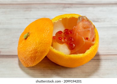 Salmon Flesh And Roe With Turnip Pickles Served In A Mandarin Orange Container As Festive Food For The New Year