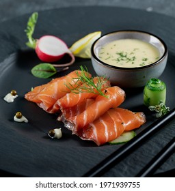 Salmon Gravadlax with mustards sauce in dark plate.  - Shutterstock ID 1971939755
