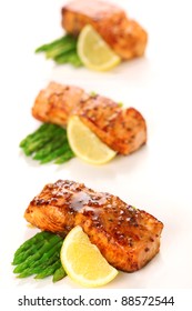 Salmon With Honey Mustard Marinade And Asparagus On White Background.