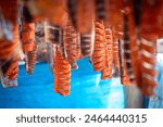 Salmon are hung outside to dry in the small fishing village of Koyuk, Alaska. The fish help to sustain the Inuit people over the very difficult winter.