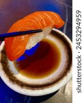 Salmon nigiri with soyu sauce.
This is one of sushi types which put a slice of raw salmon above the rice ball.