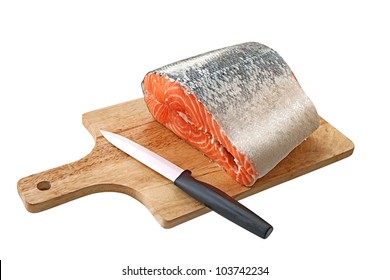 Salmon on a cutting board isolated over white background